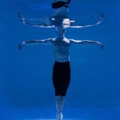 young-man-posing-submerged-underwater